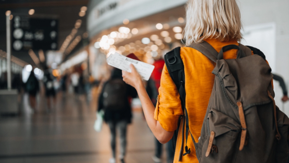 traveller holding the passport at airport