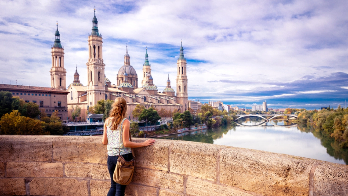 an image of a woman looking over Zaragoza, Spain