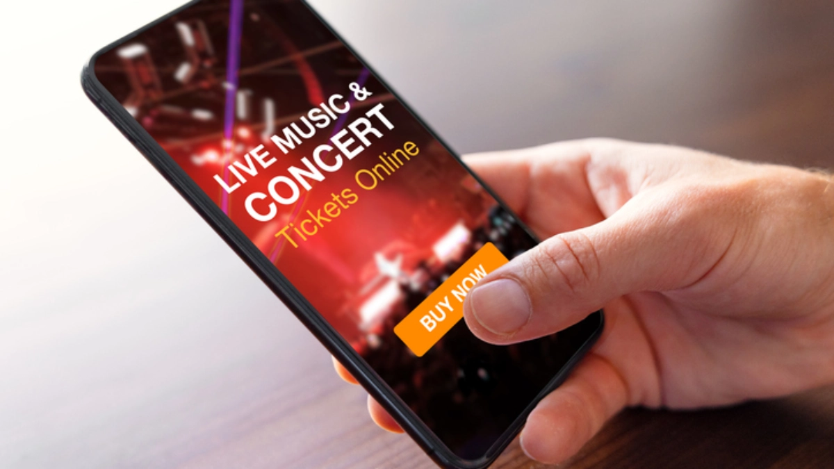 an image of a person buying tickets to a concert