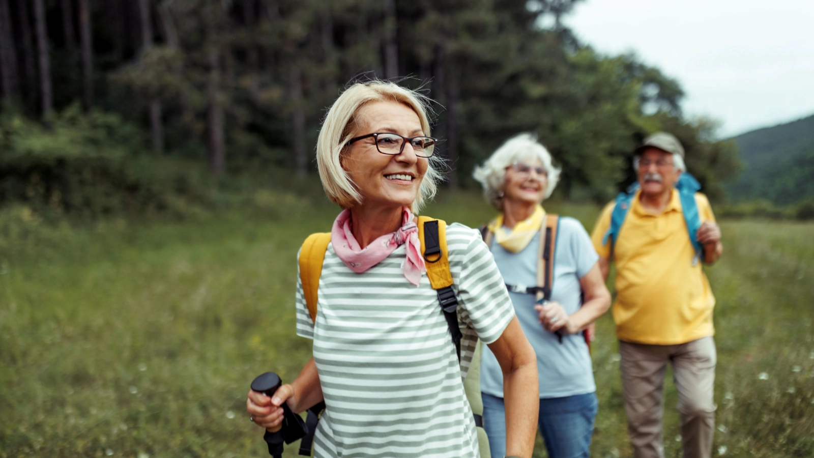 Mature woman enjoying her day in forest with friends