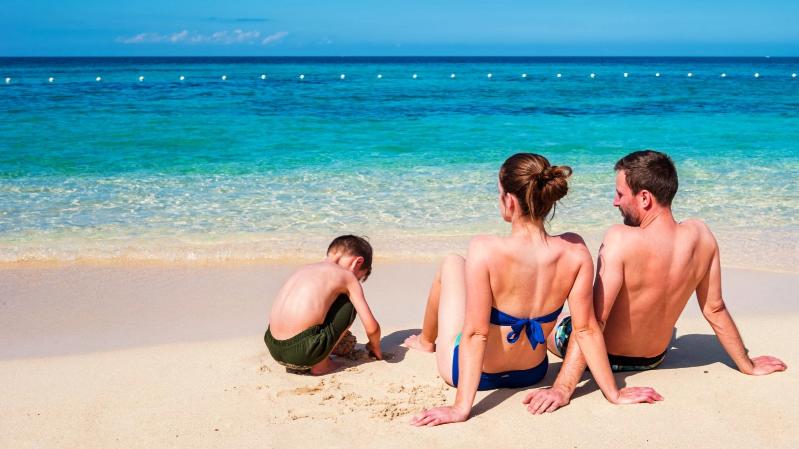 Family enjoys tropical beach