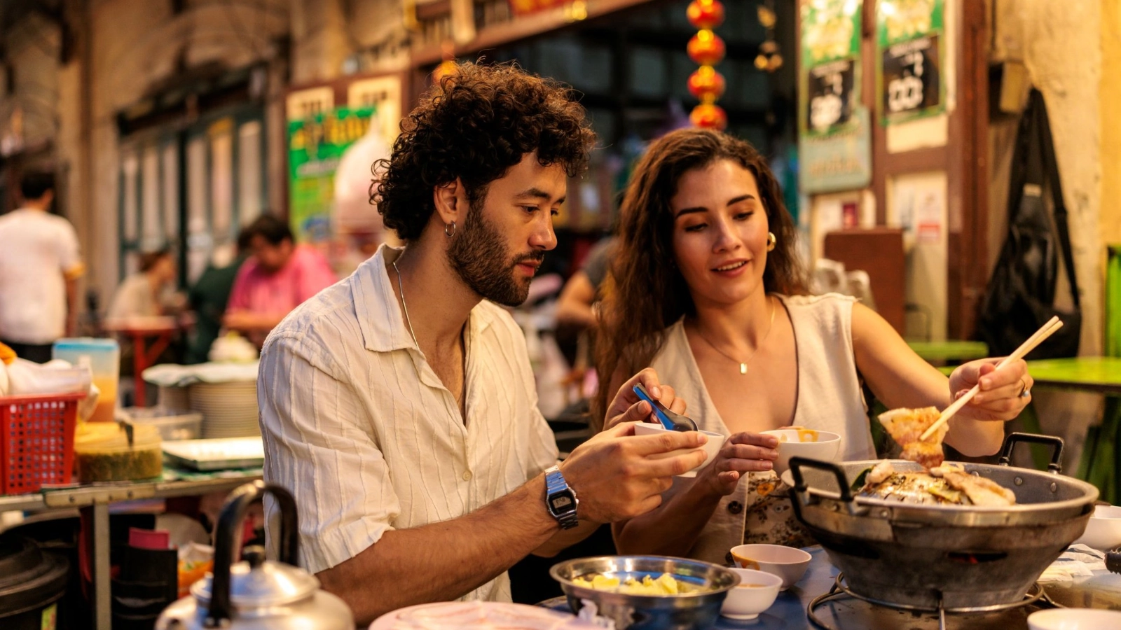 Two people enjoying a hot pot dinner in Bangkok's Chinatown