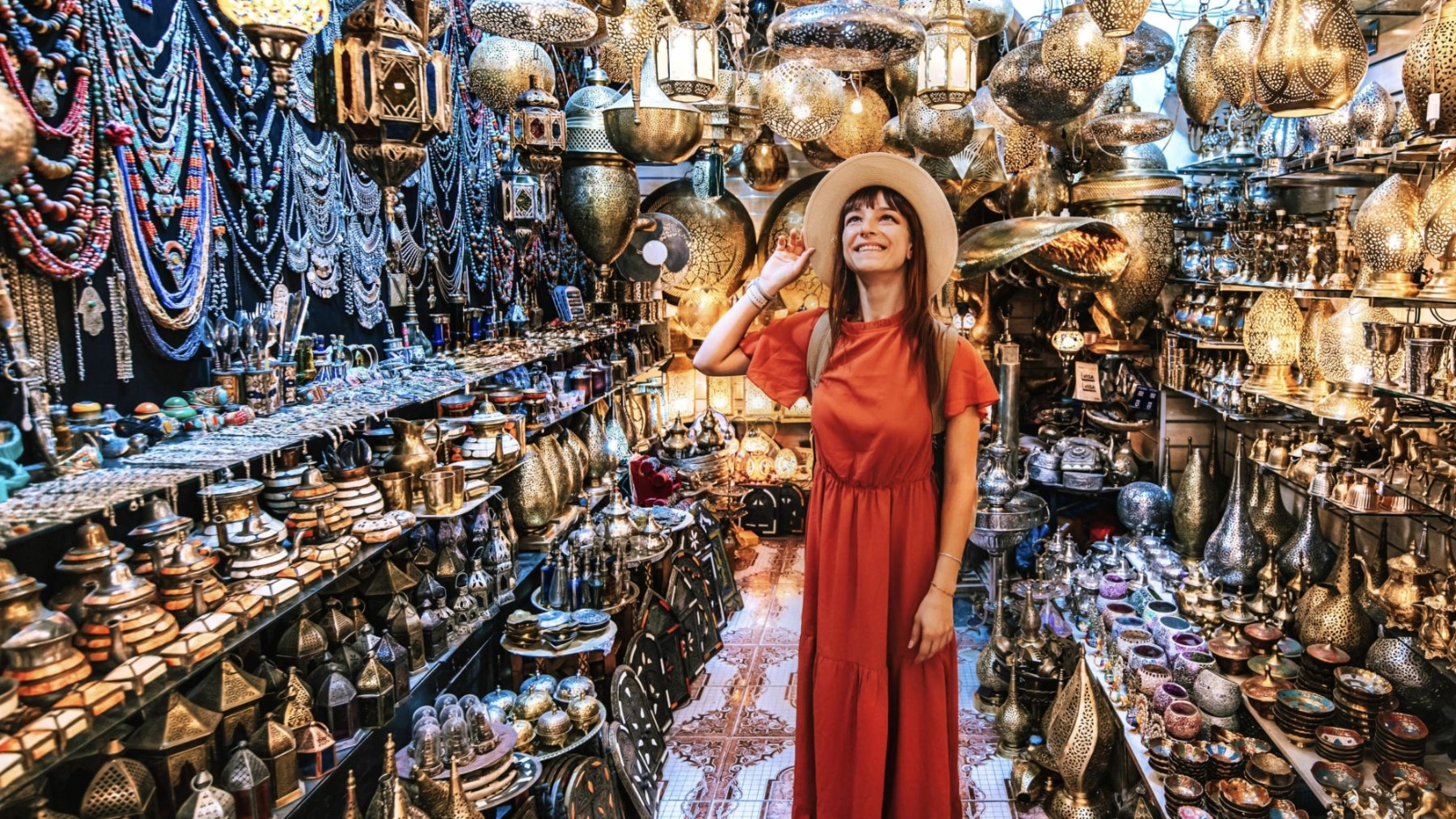 Woman visiting a copper souvenir handicraft shop in Marrakesh, Morocco 
