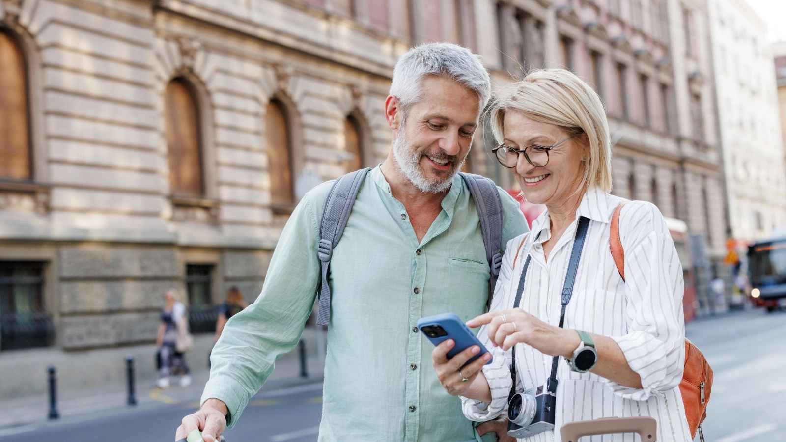 Two travellers looking at the phone 