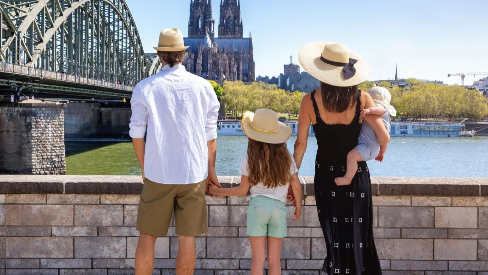 Family looks at the cityscape of Cologne, Germany