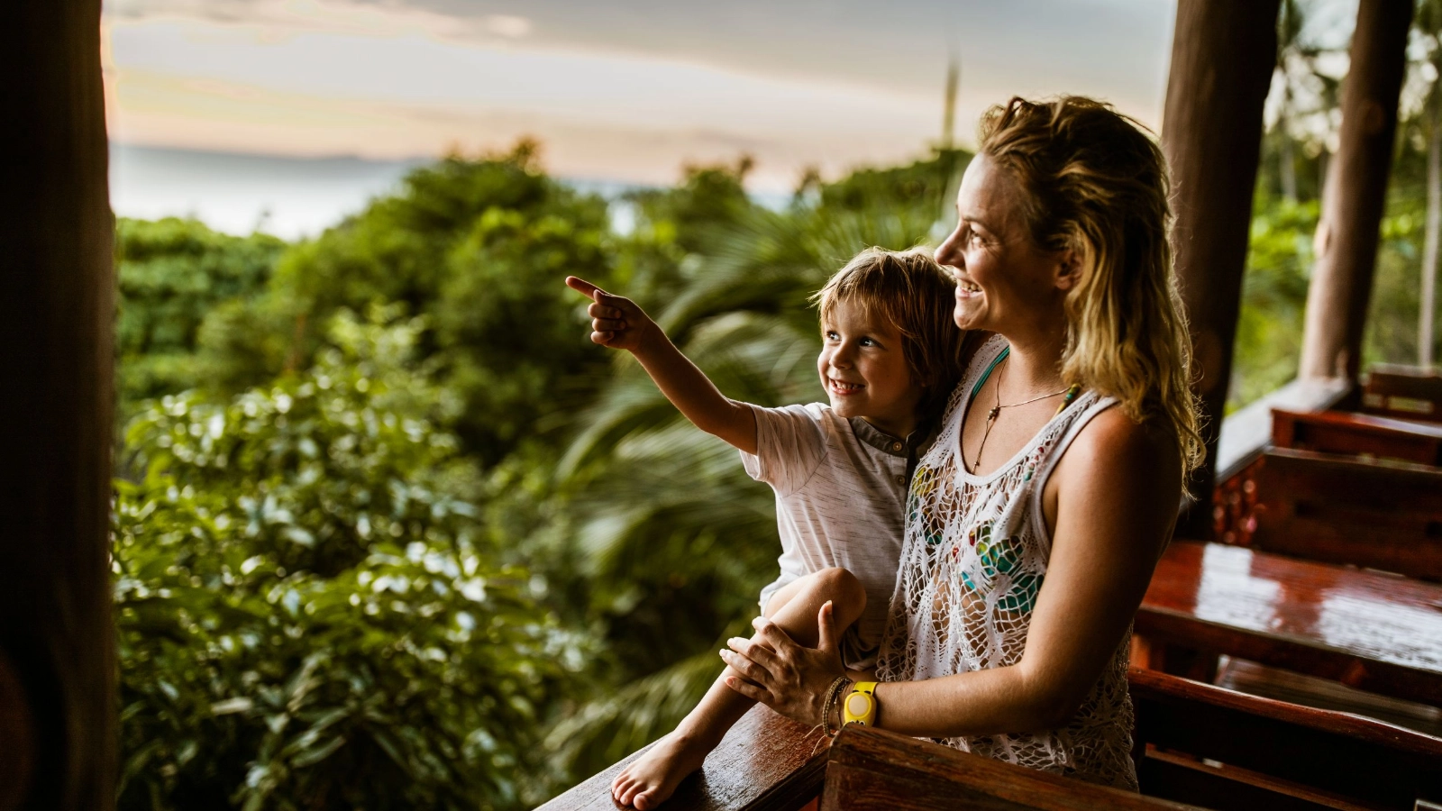 A Mother and child enjoying a balcony view in Thailand
