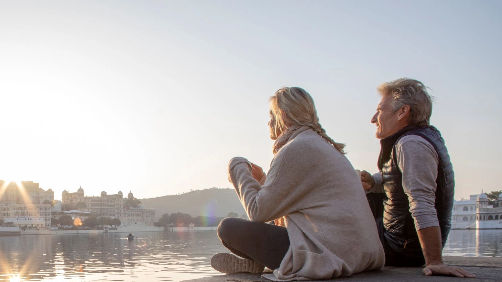 Couple explores a ghat at sunrise