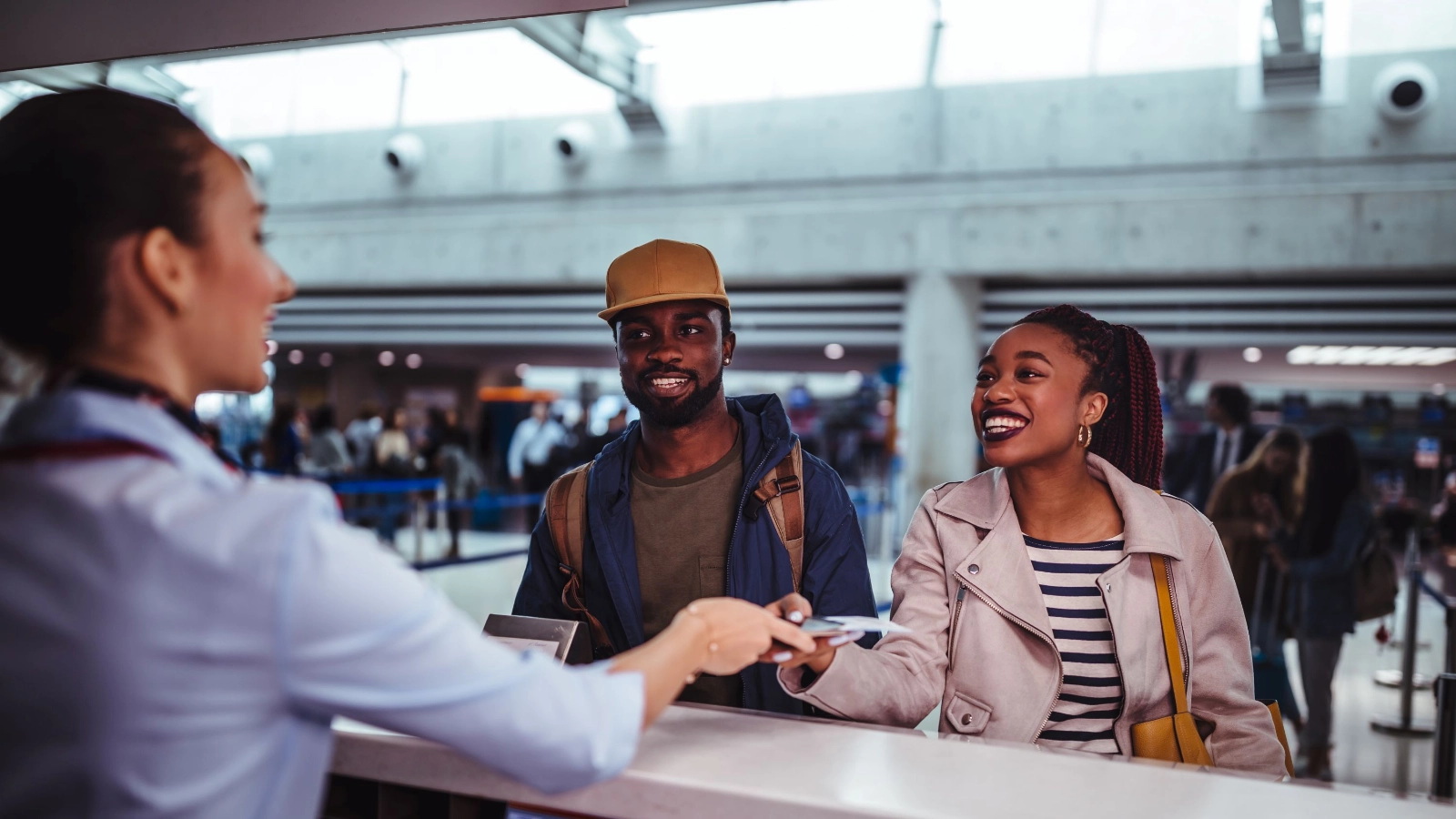 Passengers doing check-in for flight at airport