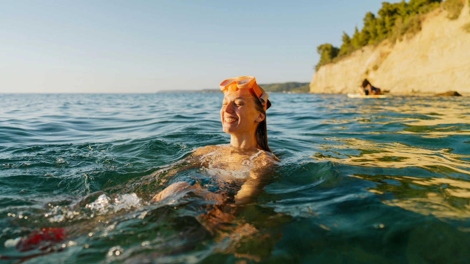 Young woman swimming in the sea