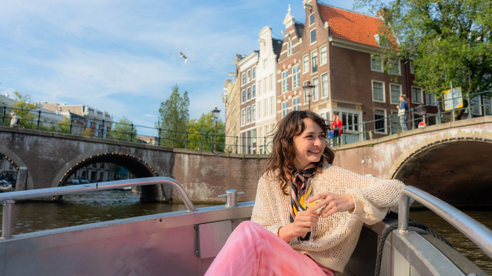 Woman enjoying boat ride in Amsterdam