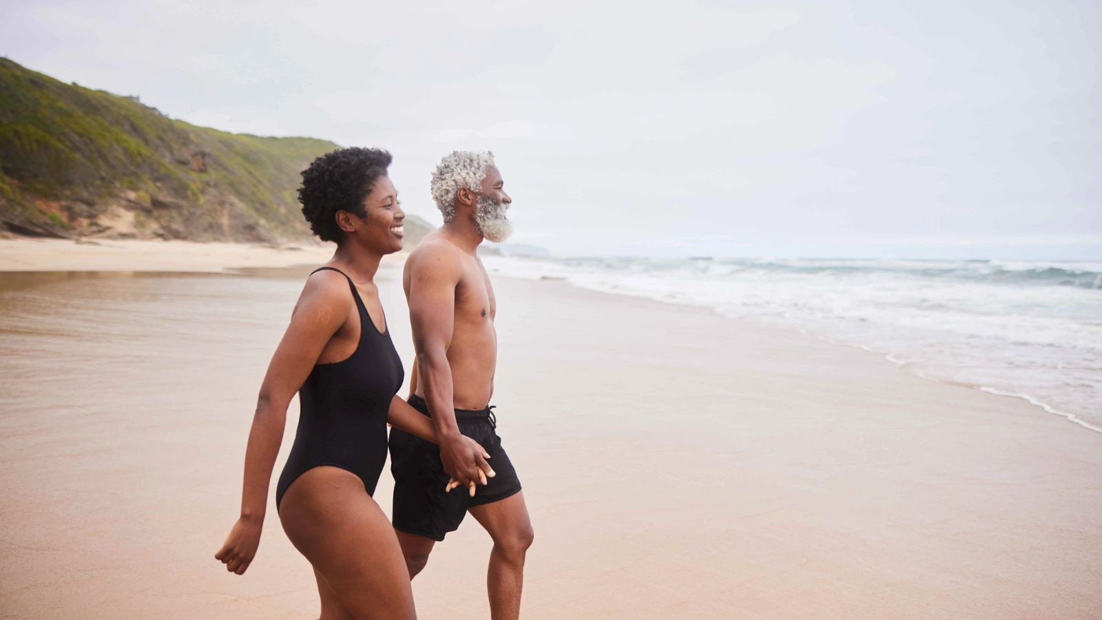 Over 50s couple holding hands