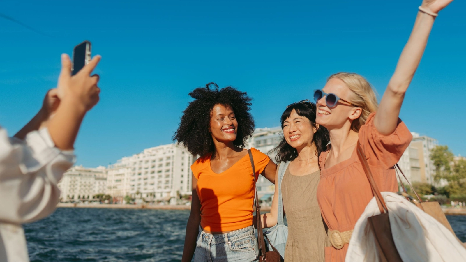 Female tourists being photographed while visiting a new city