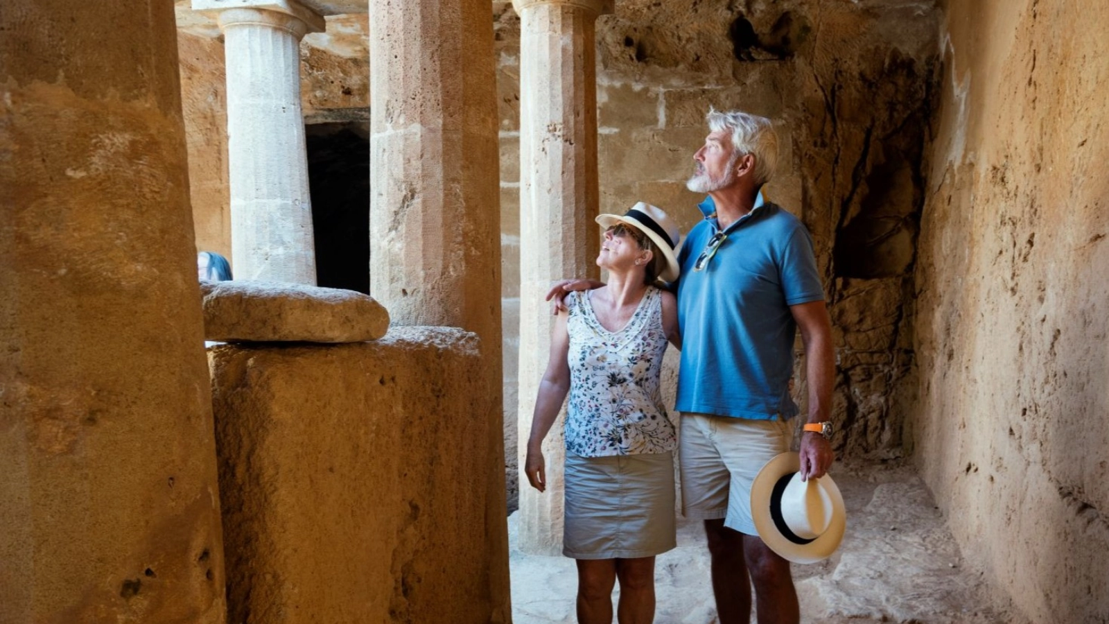 Couple visiting Cyprus, tombs of the kings necropolis on Paphos