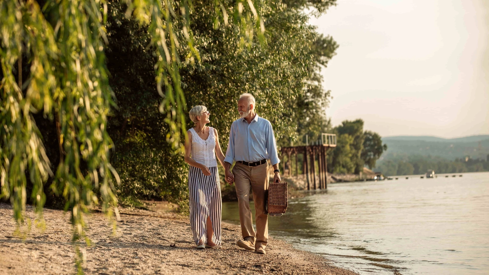 Senior couple walking on the beach