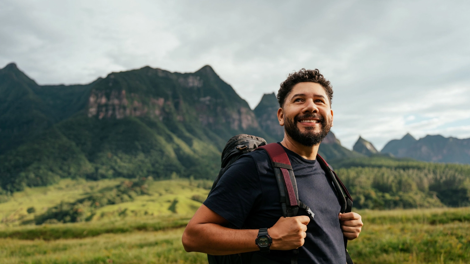 Adventurous man walking in the mountains