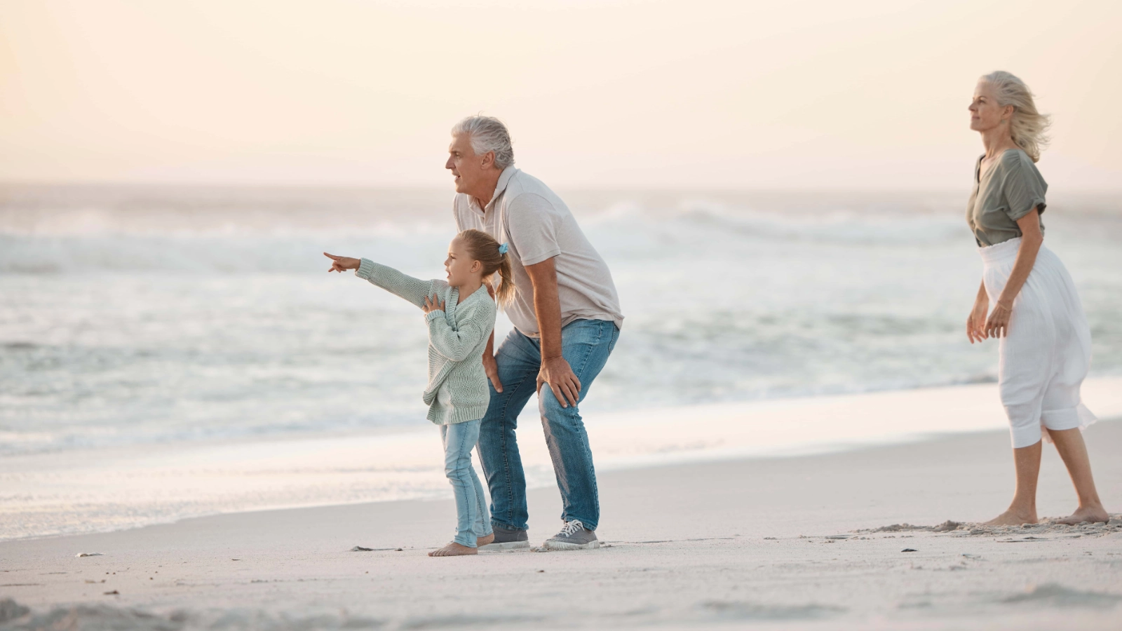 Grandfather and grand daughter at the beach