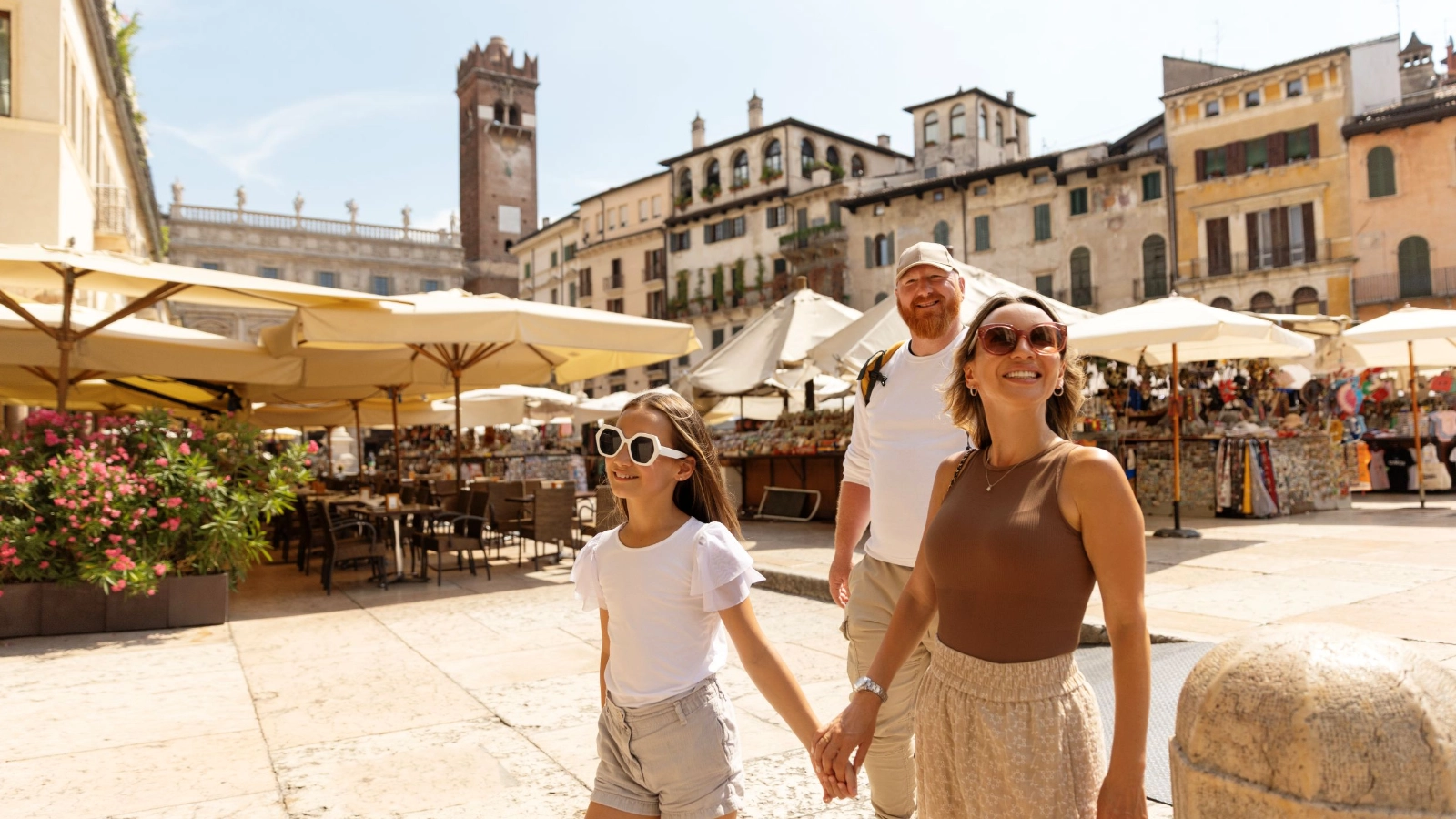 A family on a touristic day trip in Verona, Italy on a summer's day.