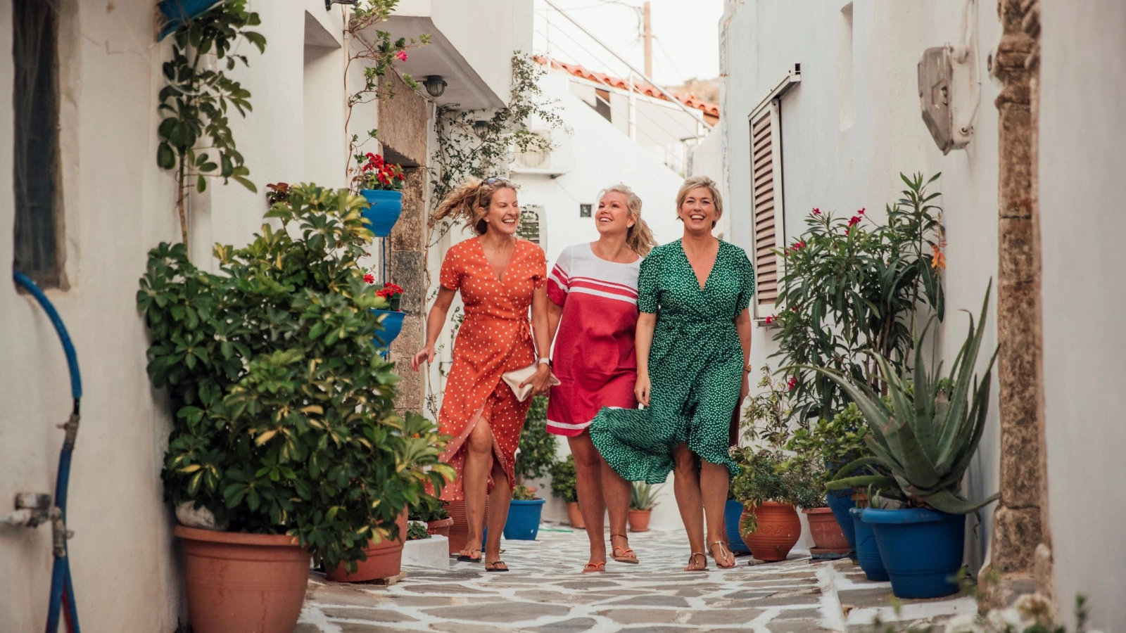 Sightseeing friends strolling through traditional village