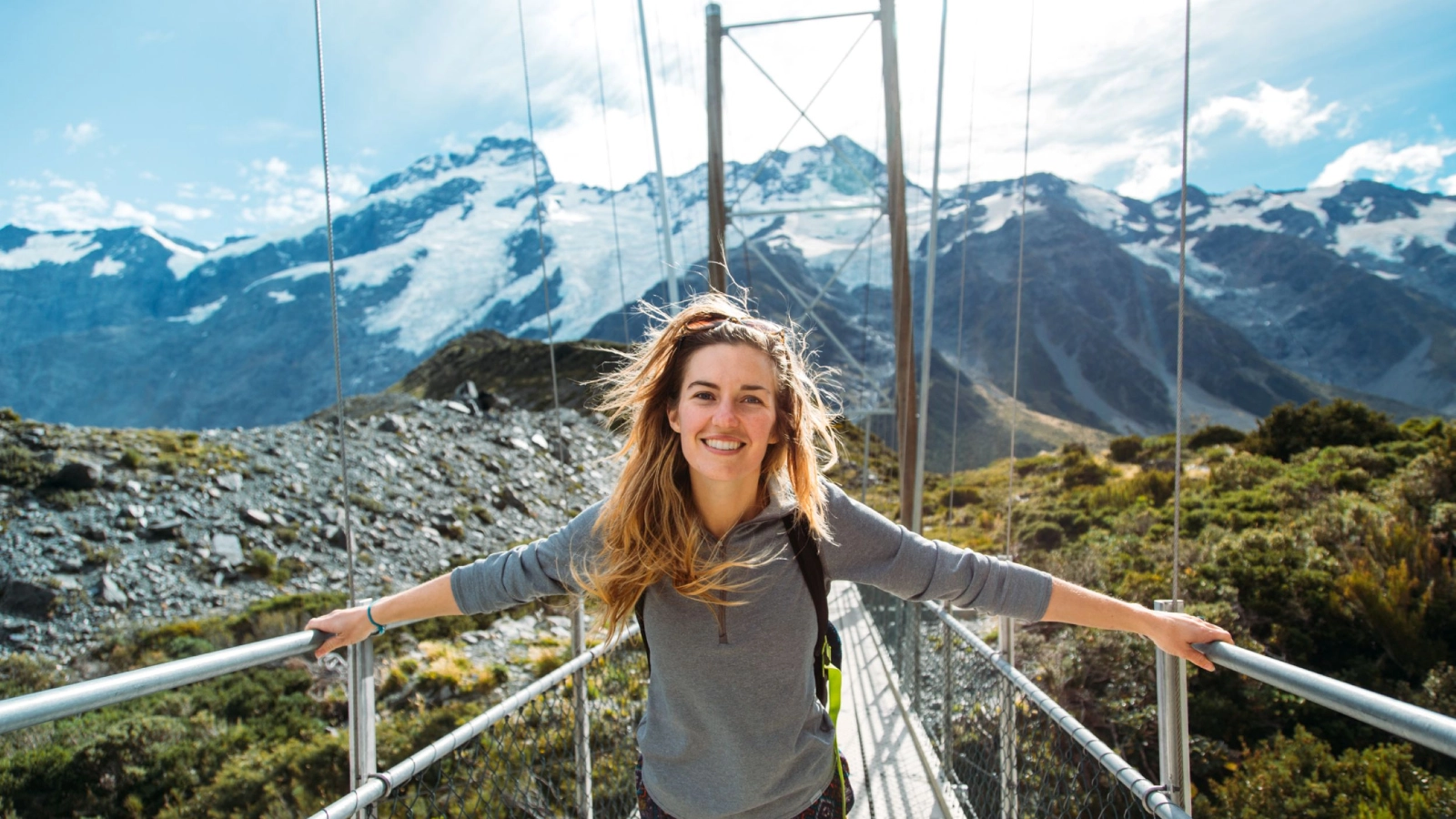 Girl on swing bridge New Zealand 