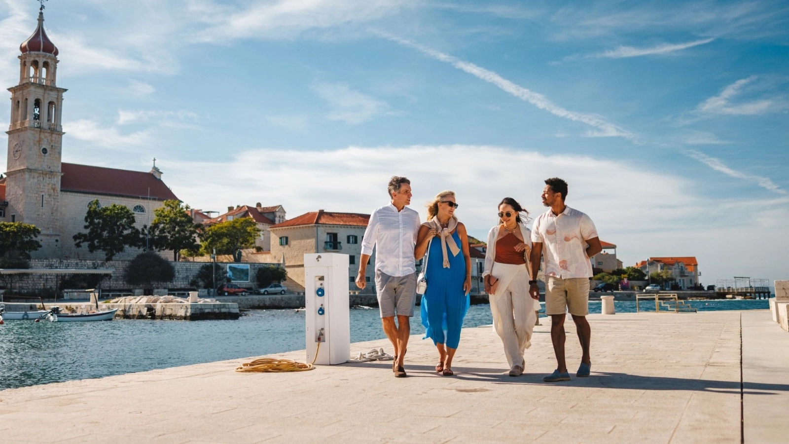 A group enjoying coastal stroll on Dalmatian Pier
