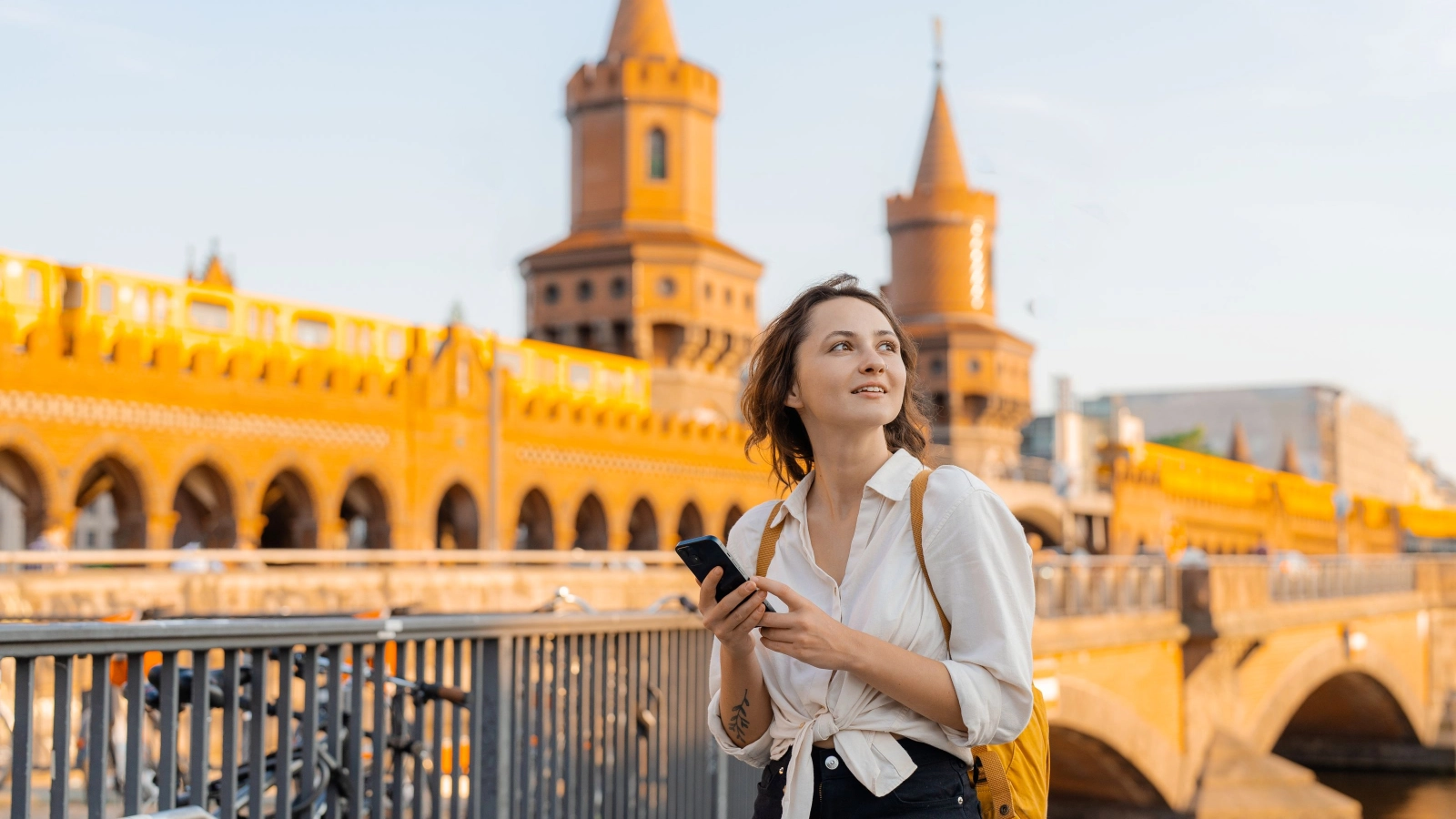 Tourist walking in Berlin on the background of Oberbaumbrucke
