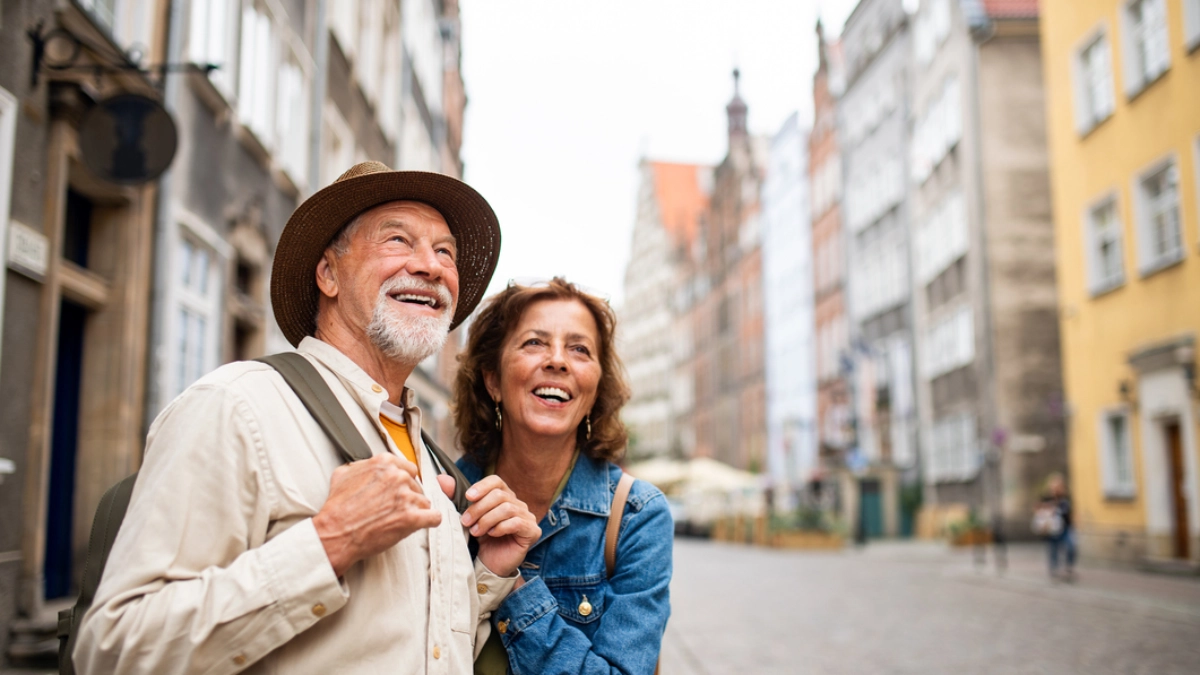 an image of a happy old couple travelling